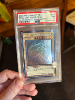 2022 YUGIOH 1st ED Blue Eyes White Dragon PSA 7 - Image 1