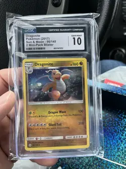 Pokemon Dragonite Cosmos Holo Pendant Sun and Moon 96/149 CGC 10 Gem Mint - Image 1