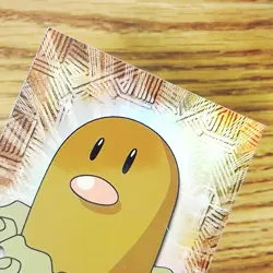 DIGLETT 50 TOPPS Pokemon Rainbow Holo Foil Card - TEXTURED w/Rays - Image 1