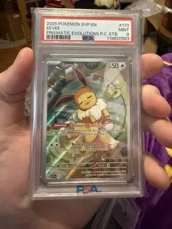 2025 POKEMON PRISMATIC EVOLUTIONS POKEMON CENTER ETB PROMO #173 EEVEE PSA 9 - Image 1