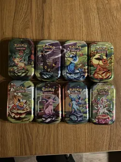 Prismatic Evolutions *EMPTY* Mini Tin Complete Set Of 8 (Tin + Card + Coin) - Image 1