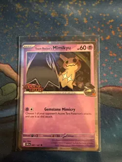Team Rocket's Mimikyu 087/182 Destined Rivals Prerelease Stamped Cosmos Holo - Image 1