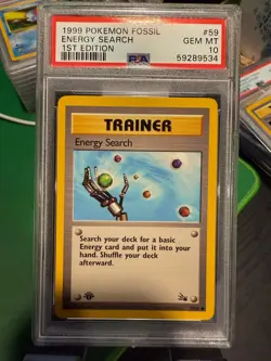 1999 POKEMON FOSSIL 1ST ED #59 ENERGY SEARCH PSA 10 - Image 1