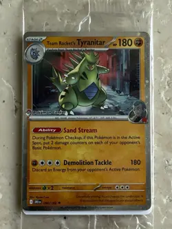 Team Rocket's Tyranitar 096/182 Sealed | Destined Rivals | Pokemon Center Stamp - Image 1