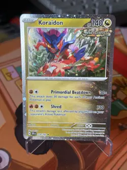 Pokemon Koraidon 119/162 Checklane Exclusive Promo Cosmos Holo NM - Image 1