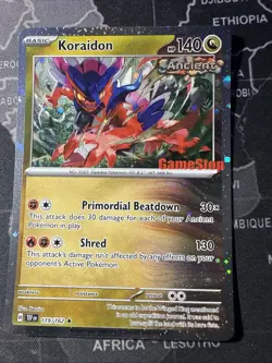 Pokemon Koraidon 119 Temporal Forces GameStop Exclusive Cosmos Holo Promo PSA 10 - Image 1