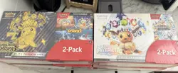 Pokemon Prismatic Evolutions & Surging Sparks Etb Costco Bundle - Image 1