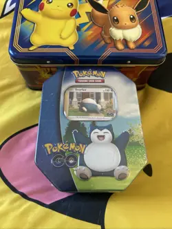 One Factory Sealed Pokemon TCG 2022 Collector's Tin: Pokemon Go (Snorlax Promo) - Image 1