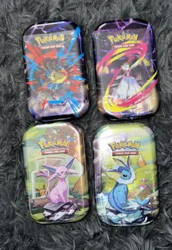 Pokemon Mini Tins LOT OF 4 NEW SEALED Prismatic Evolutions (2) Mega Heroes (2) - Image 1