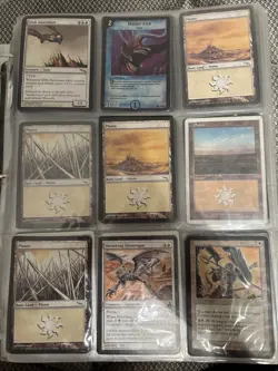 White binder full of Pokemon, Yu-Gi-Oh, and WotC cards. - Image 1