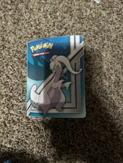 mini pokemon binder filled with some rare cards and some regular cards - Image 1