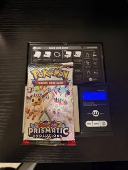 Pokemon TCG Prismatic Evolutions Heavy Booster Pack 23.83g - Image 1