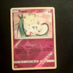 2019 Pokemon Togepi 136/214 Sm-Unbroken Bonds Reverse Holo - Image 1