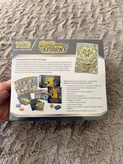 Surging Sparks Pokemon Center Exclusive ETB + 4 Sealed Packs Of Evolving Skies - Image 3