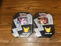 Pokemon 25th Anniversary Celebrations Tin Set: Lance's Charizard & Dark Sylveon - Image 1