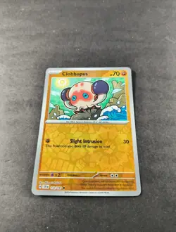 Pokemon Surging Sparks Clobbopus Reverse Holo Common Card 112/191 NM - Image 1