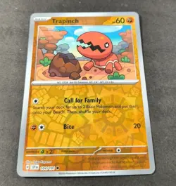 Pokemon Surging Sparks Trapinch Reverse Holo Common Card 104/191 NM - Image 1