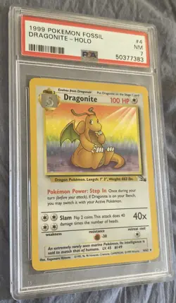 1999 Pokemon Fossil Dragonite Holo Rare Card 4/62 PSA 7 - Image 1