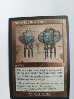 Aetherflux Reservoir (Schematic) The Brothers' War: Retro Frame Artifacts Foil - Image 1
