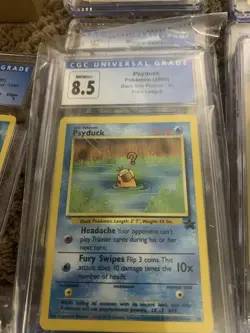 CGC 8.5 Psyduck 2000 Black Star Promos 20 Pokemon - Image 1