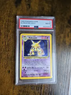 1999 POKEMON BASE SET UNLIMITED #1 ALAKAZAM-HOLO PSA 8 - Image 1