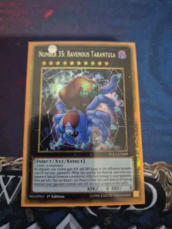 PGL3-EN009 NUMBER 35: RAVENOUS TARANTULA GOLD SECRET RARE 1ST ED YuGiOh CARD - Image 1