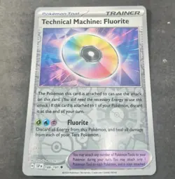 Pokemon Surging Sparks Technical Machine: Fluorite Reverse Holo Trainer Card - Image 1