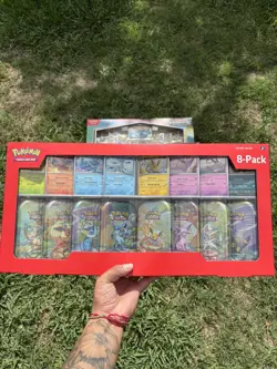 Pokemon TCG: Scarlet & Violet Prismatic Evolutions 8 Pack Mini Tin Set (Costco) - Image 1