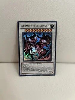 Yu-Gi-Oh Atomic Scrap Dragon STOR-EN043 Ultra Rare Near Mint Card - Image 1