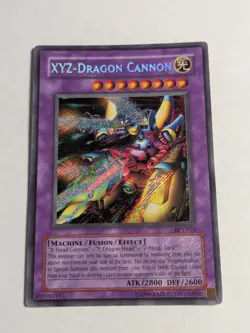 Yugioh XYZ-Dragon Cannon BPT-010 Secret Rare Foil Bleed MP - Image 1