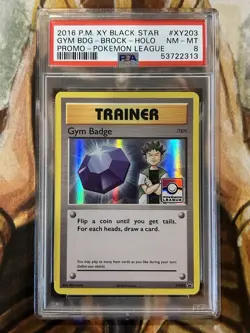 2016 Pokemon Gym Badge Brock #XY203 Pokemon XY League Black Star Promo - PSA 8 - Image 1