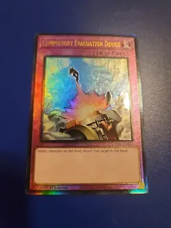 YuGiOh! Compulsory Evacuation Device (RA01-EN069) 1st - Prismatic Ultimate - NM - Image 1