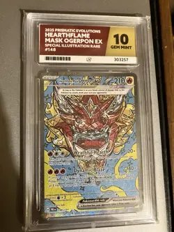 Pokemon TCG Prismatic Evolutions Hearthflame Mask Ogerpon 148/131 Ace Grading 10 - Image 1