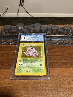 1999 POKEMON BASE SET UNLIMITED #11/102 NIDOKING RARE HOLO CGC 8 - Image 1
