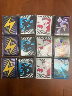 Lot of 12 Assorted Pokemon Sealed ETB Card Sleeves With Tin - Image 1