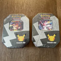 Pokemon Celebrations Tin Set - Dark Sylveon & Lance’s Charizard - Sealed - Image 1