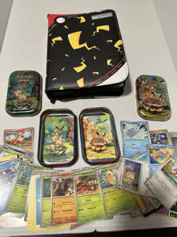 Pokemon Cards, Binder, Tins, and Promo Coins Lot - Image 1
