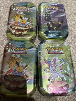 Lot of 4 - Pokemon TCG - Prismatic Evolutions Mini Tins - FACTORY SEALED - Image 1
