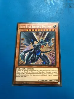 YUGIOH Secret Rare Blue-Eyes Shining Dragon LCKC-EN008 1st Edition - Image 1