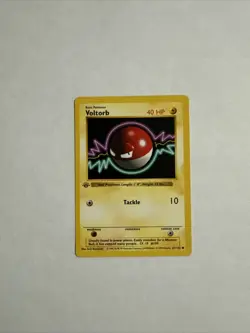 Pokemon Voltorb 67/102 1st Edition Shadowless Base Set Card - Image 1