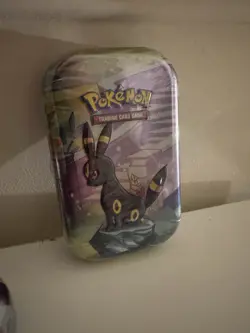 TCG Prismatic Evolutions Mini Tin Umbreon (Sealed In Hand) Pokemon Trading Card - Image 1