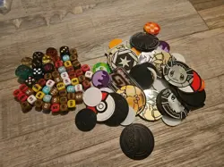 Lot Of 102 Pokemon Coins And Dice There Is 56 Dice And 47 Coins - Image 1