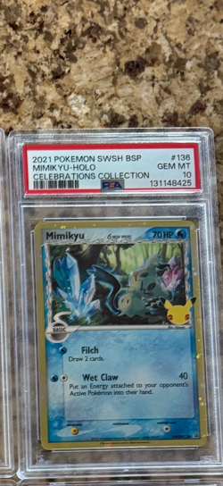 PSA 10 Pokemon Card Mimikyu SWSH136 Delta Species Celebrations Black Star Promo - Image 1