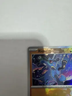 Pokemon TCG Prismatic Evolutions Riolu Card 050/131 Master Ball Reverse Holo - Image 4
