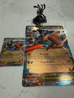 Mega Lucario Promo Card , Jumbo Promo Card, And Mega Lucario Figure - Image 1