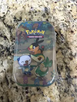New Pokemon TCG Celebrations Unova Mini Tin Pack Sealed Snivy Tepig Oshawott - Image 1
