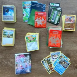 Pokemon Trading Game Tin- Mix Lot Cards 400+ , 100+ Sleeves, Manual, & Tin - Image 1