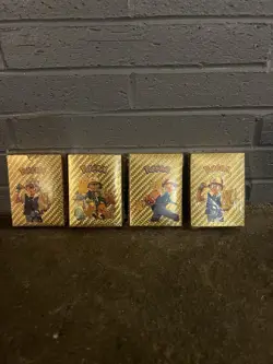 Four Packs Of Pokemon Gold Foil Card Decks New Sealed. - Image 1