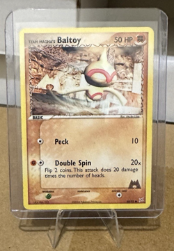 Team Magma's Baltoy 60/95 Pokemon Team Magma Vs. Aqua Non Holo LP 2004 - Image 1