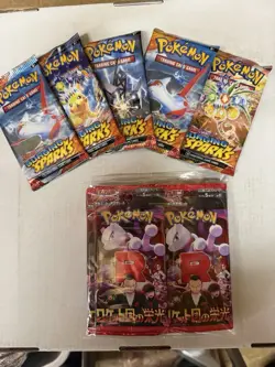 Pokemon Surging Sparks And Glory Of Team Rocket Booster Packs - Image 1